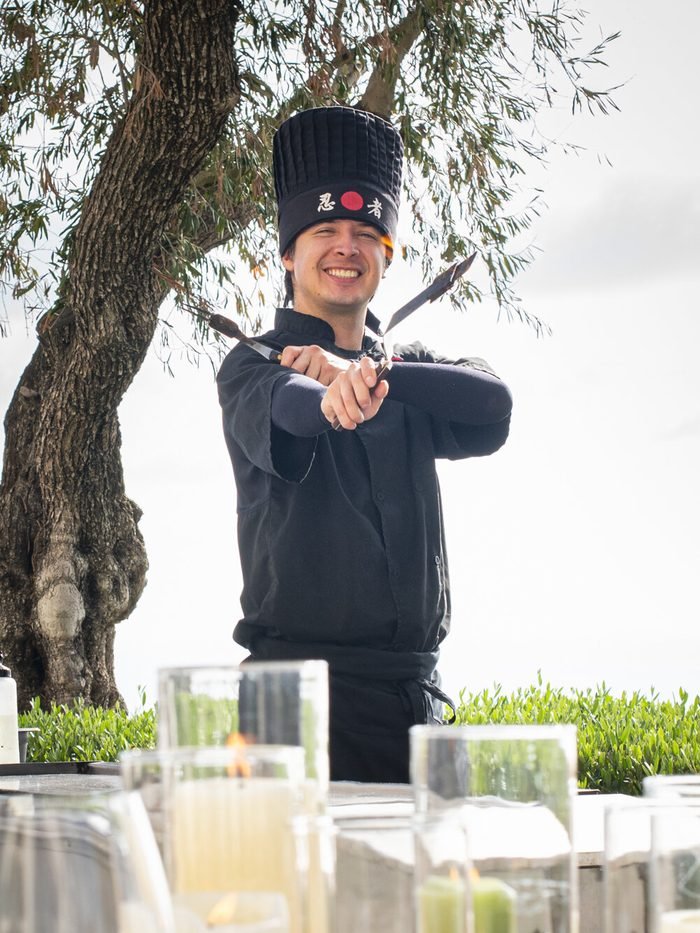 A Hibachi Queens chef greeting guests